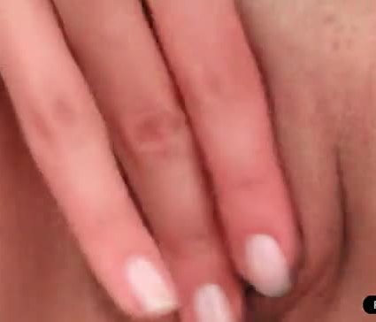 Amaizing brunette enjoys fingering her pink pussy